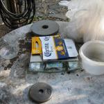 As the green sand mixture is done by weight, the bathroom scale helps out, covered with a high tech scratchproof cover